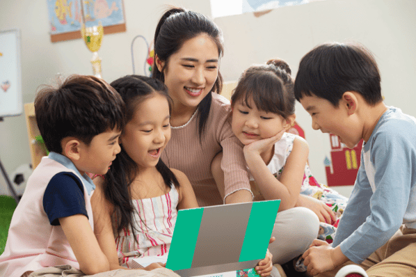 Teacher reading a story to preschool children.