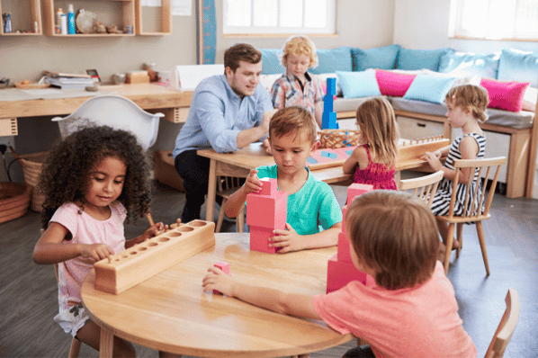 Teacher and children learning in a preschool classroom