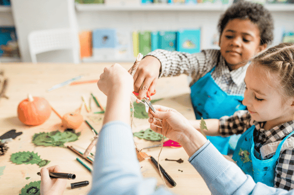 Two children making arts and crafts