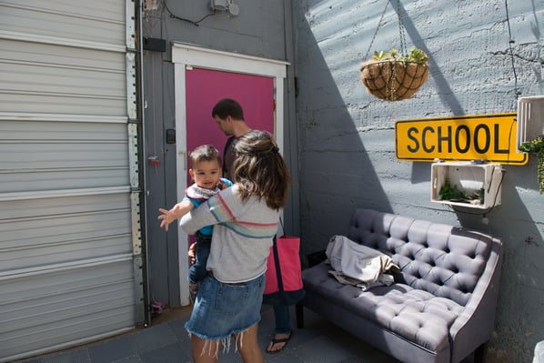 Mother drops off child at daycare