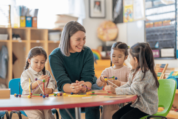 Students with teacher at preschool