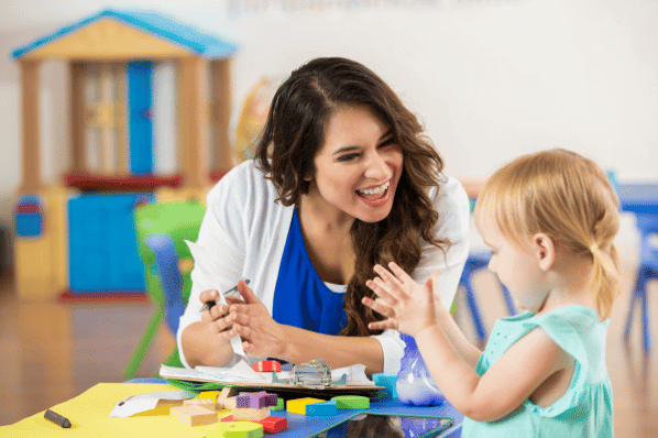 Teacher praises child in classroom