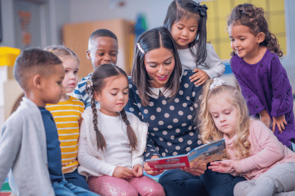 Teacher reading to daycare children.